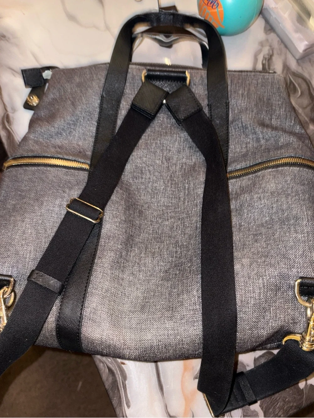 Henri Bendel jetsetter convertible backpack Wearing on the short straps